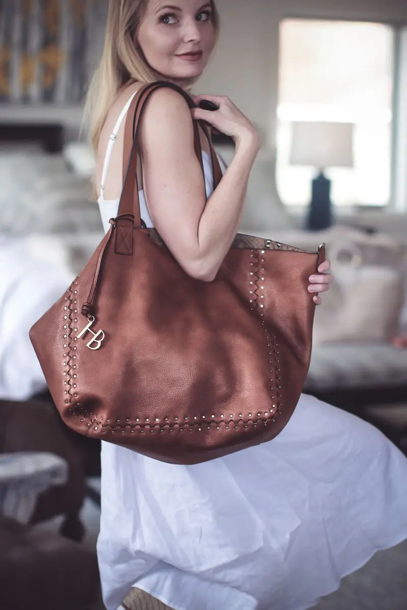 Best accessories featuring a saddle slouchy tote oversized from Henri Bendel on fashion blogger Erin Busbee over 40 of Busbee Style