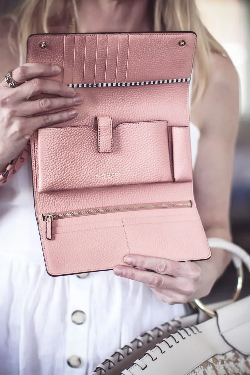 Best accessories featuring a wristlet wallet in peach from Henri Bendel on fashion blogger Erin Busbee of BusbeeStyle.com 