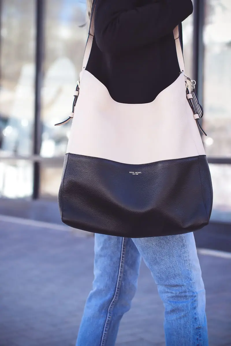 Blazer 2 Ways on fashion blogger over 40, Erin Busbee of Busbee Style wearing Madewell black blazer, Moussy tapered jeans, white button down and Henri bendel color block tote with Hifi Stuart Weitzman black sock booties