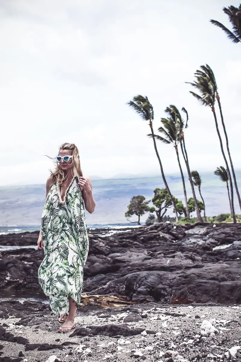 palm print flowy beach coverup from Everything but water on blond woman with retro white sunglasses on blond woman