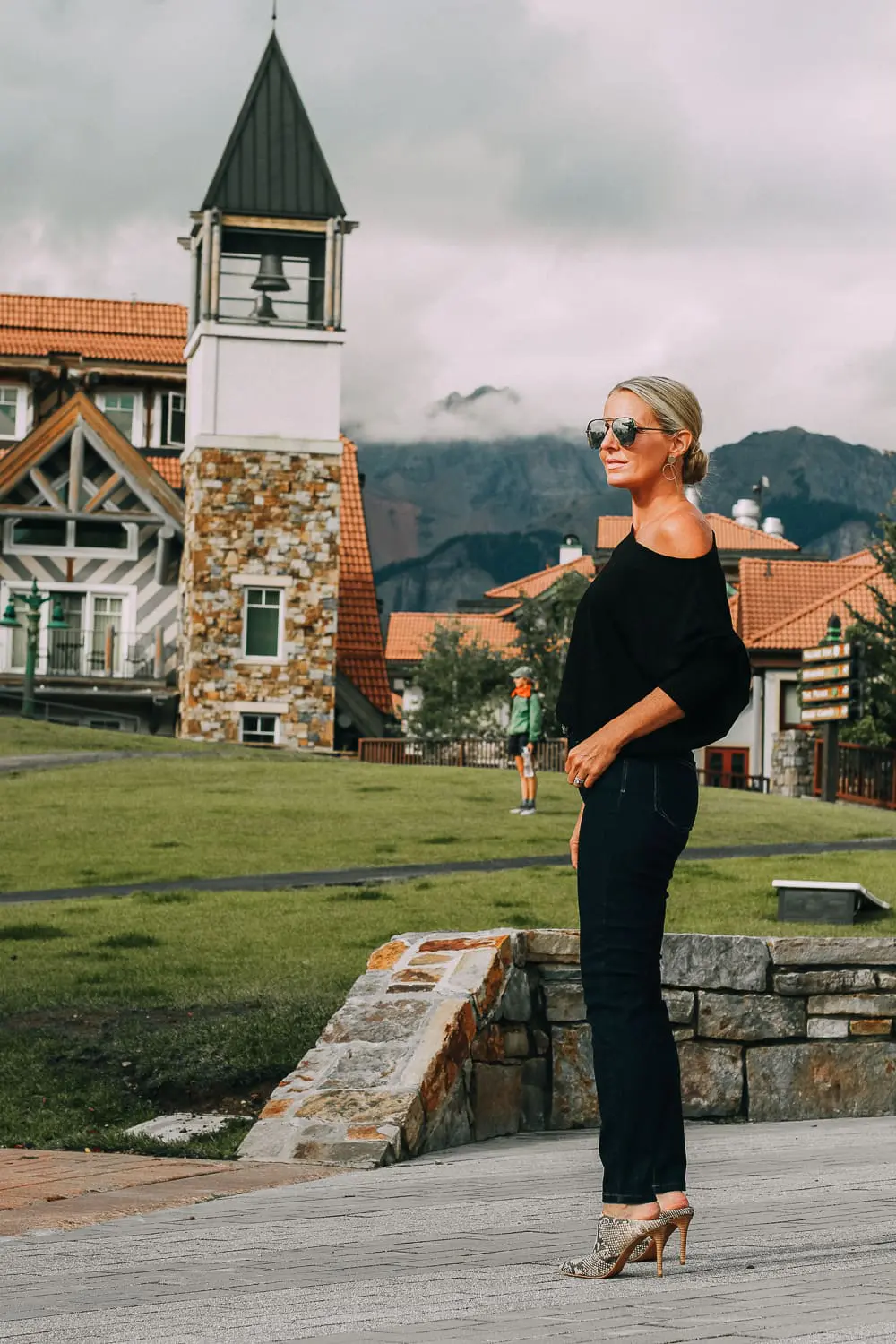 Best Jeans for Curves by Not Your Daughter's Jeans or NYDJ paired with black of shoulder dolman top, Quay aviator sunglasses, gold earrings on fashion blogger over 40, Erin Busbee of busbee style