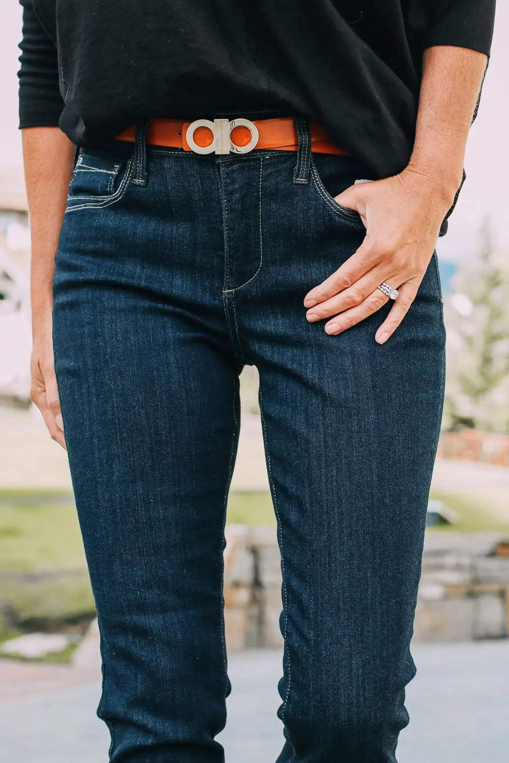 Best Jeans for Curves by Not Your Daughter's Jeans or NYDJ paired with black of shoulder dolman top, Quay aviator sunglasses, gold earrings on fashion blogger over 40, Erin Busbee of busbee style