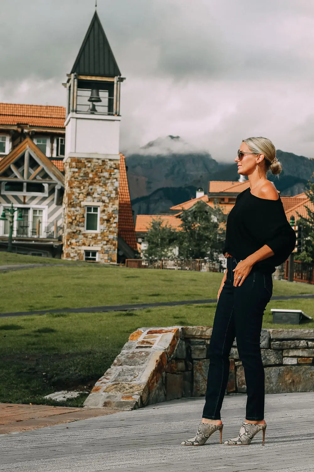Best Jeans for Curves by Not Your Daughter's Jeans or NYDJ paired with black of shoulder dolman top, Quay aviator sunglasses, gold earrings on fashion blogger over 40, Erin Busbee of busbee style