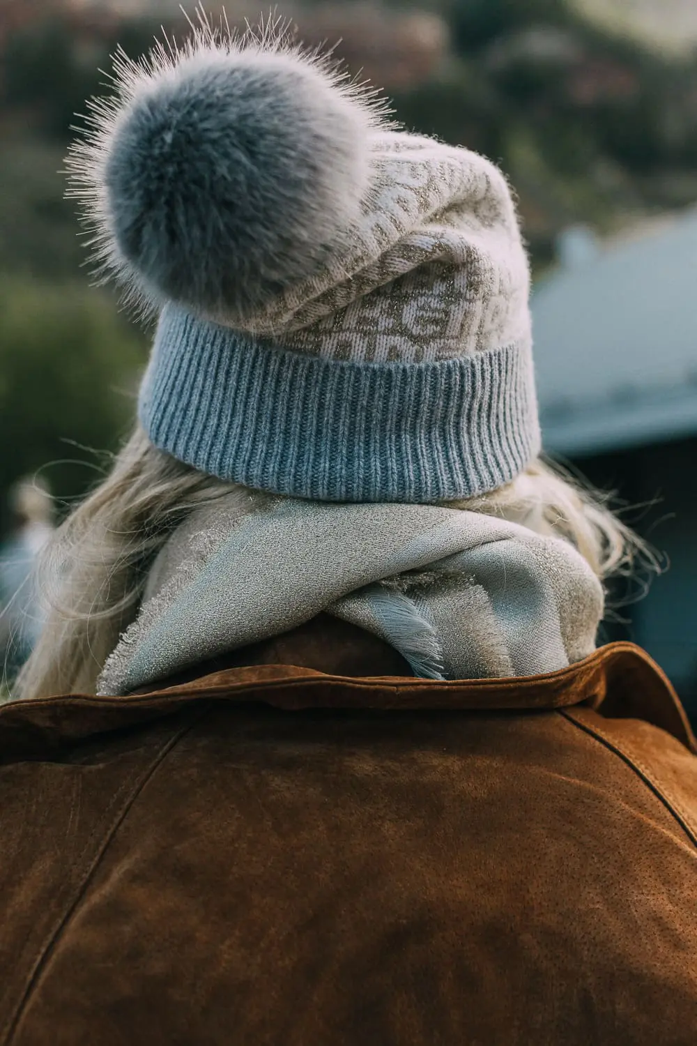 Green suede backpack by Henri Bendel paired with distressed jeans and leopard print ankle booties, brown long suede trench on blonde fashion blogger in telluride, Colorado