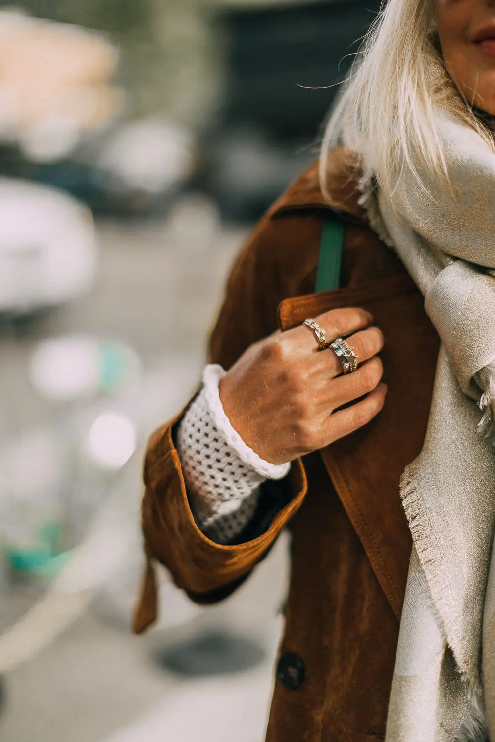 Green suede backpack by Henri Bendel paired with distressed jeans and leopard print ankle booties, brown long suede trench on blonde fashion blogger in telluride, Colorado