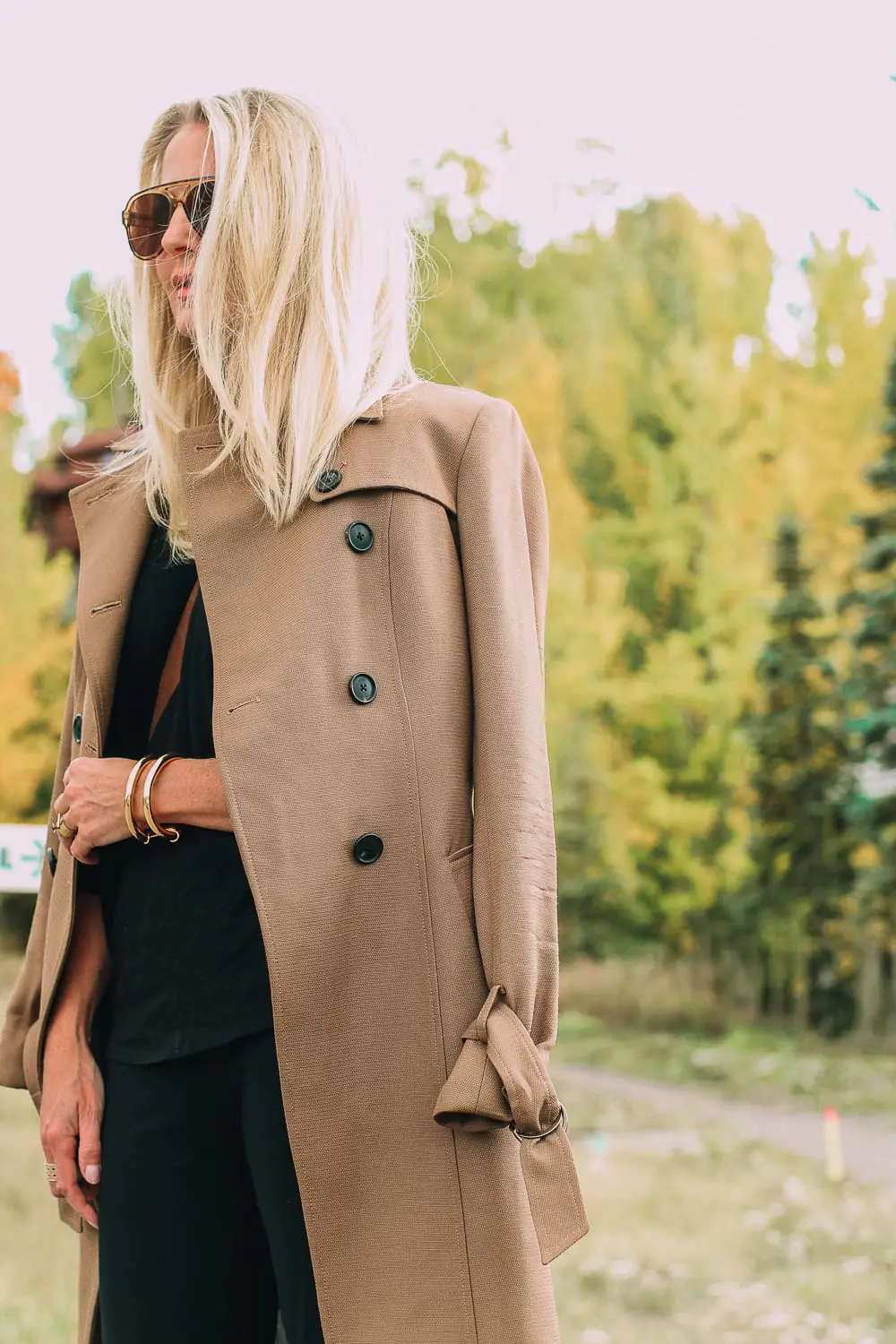 ankle boots for walking in Bison brown with low block heel and comfort, cushion technology by ECCO on fashion blogger in black joggers by Norma Kamali and black off shoulder top with brown crossbody bag