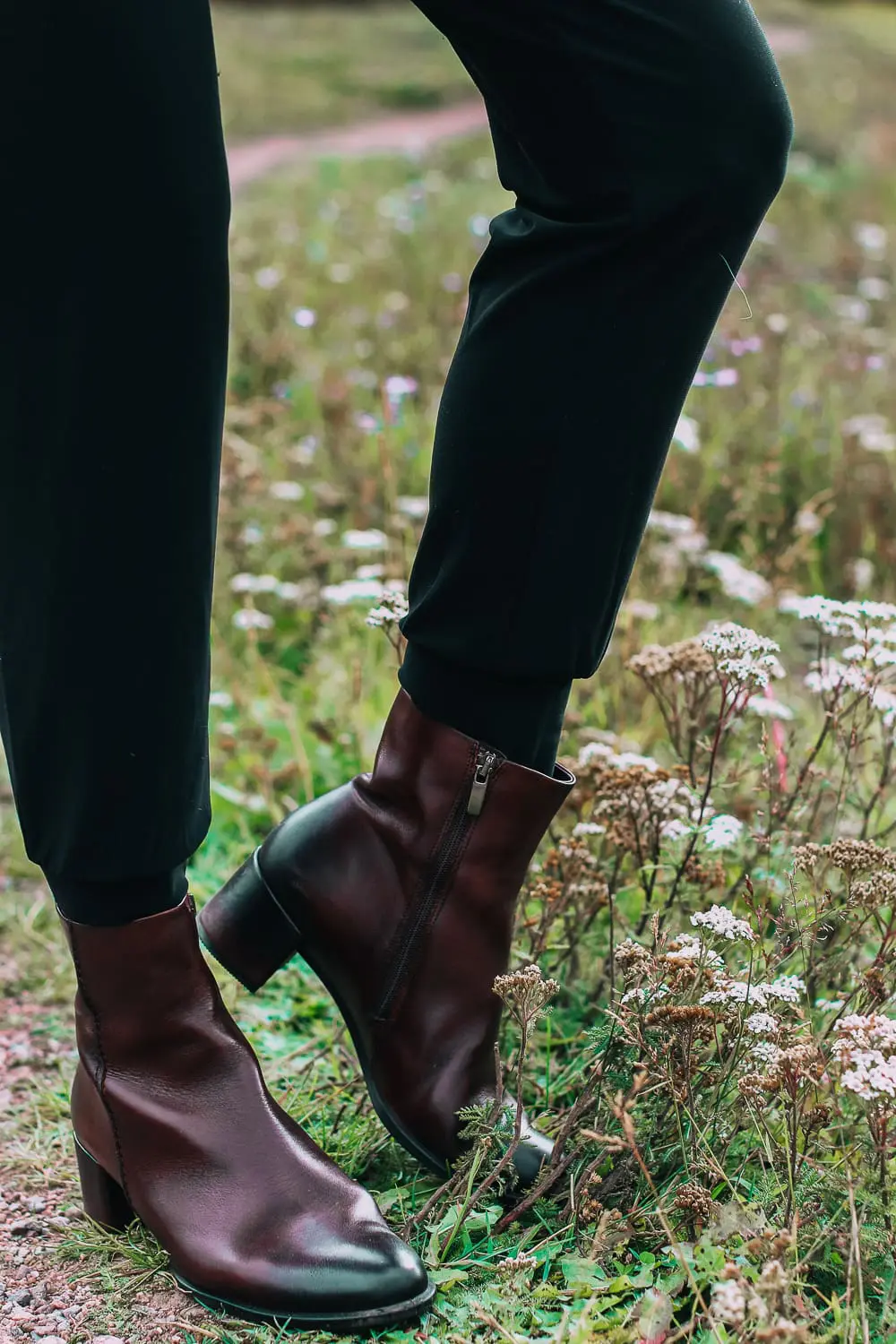 ankle boots for walking in Bison brown with low block heel and comfort, cushion technology by ECCO on fashion blogger in black joggers by Norma Kamali and black off shoulder top with brown crossbody bag