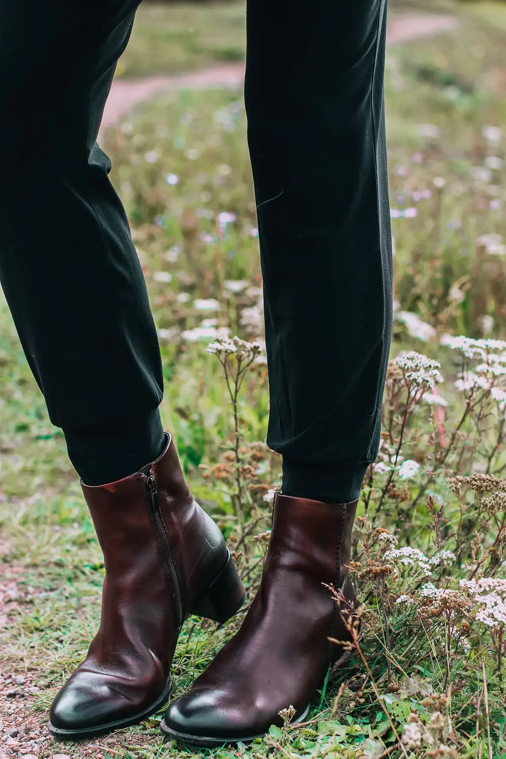 ankle boots for walking in Bison brown with low block heel and comfort, cushion technology by ECCO on fashion blogger in black joggers by Norma Kamali and black off shoulder top with brown crossbody bag