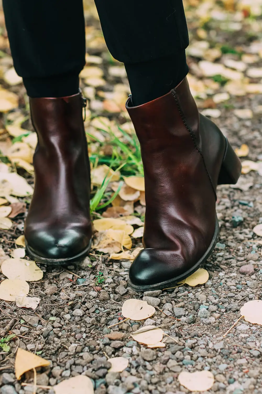 ankle boots for walking in Bison brown with low block heel and comfort, cushion technology by ECCO on fashion blogger in black joggers by Norma Kamali and black off shoulder top with brown crossbody bag