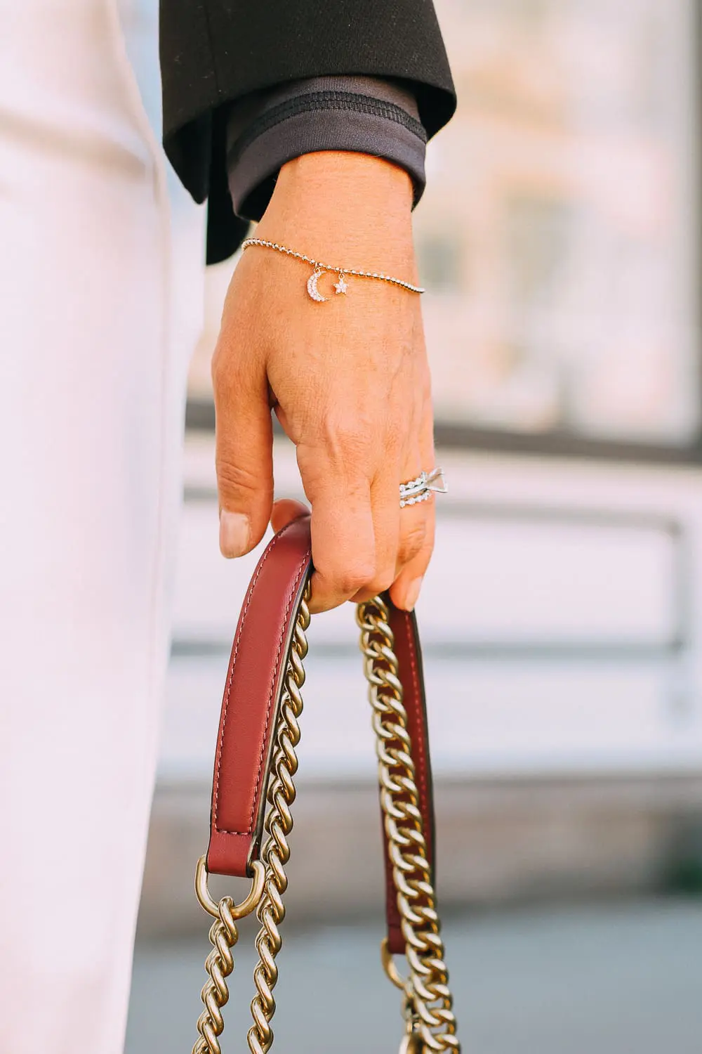 Henri Bendel quilted crossbody bag in burgundy with gold chain link detail