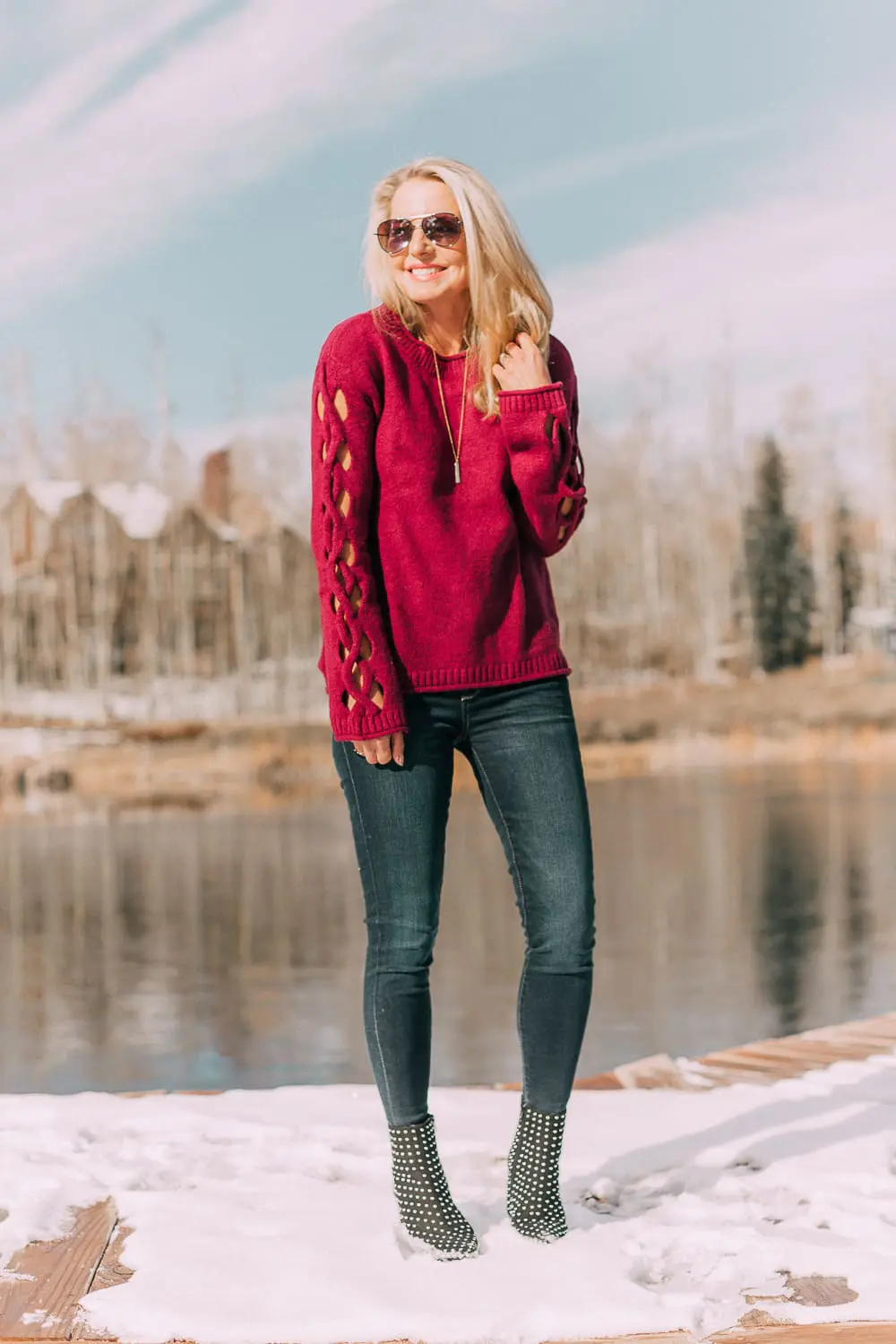 Best sweaters for fall for women 2018 featuring a hot pink crew neck sweater from JCPenney with cutouts on the sleeve on blonde fashion blogger
