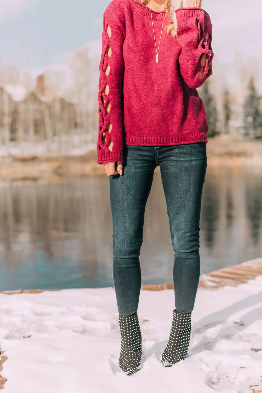 Best sweaters for fall for women 2018 featuring a hot pink crew neck sweater from JCPenney with cutouts on the sleeve on blonde fashion blogger