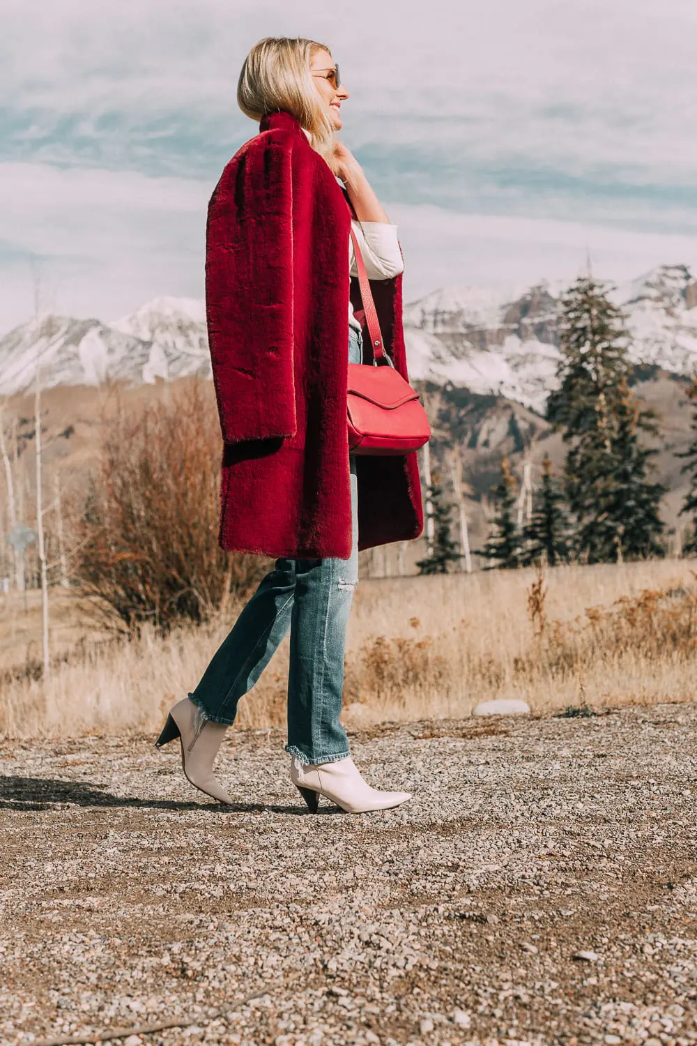 Bootie Trend, how to wear your ankle boots with dresses and jeans featuring white booties with a cone heel by Vince Camuto paired with a reversible faux fur coat, white turtleneck and Mother dazzler jeans