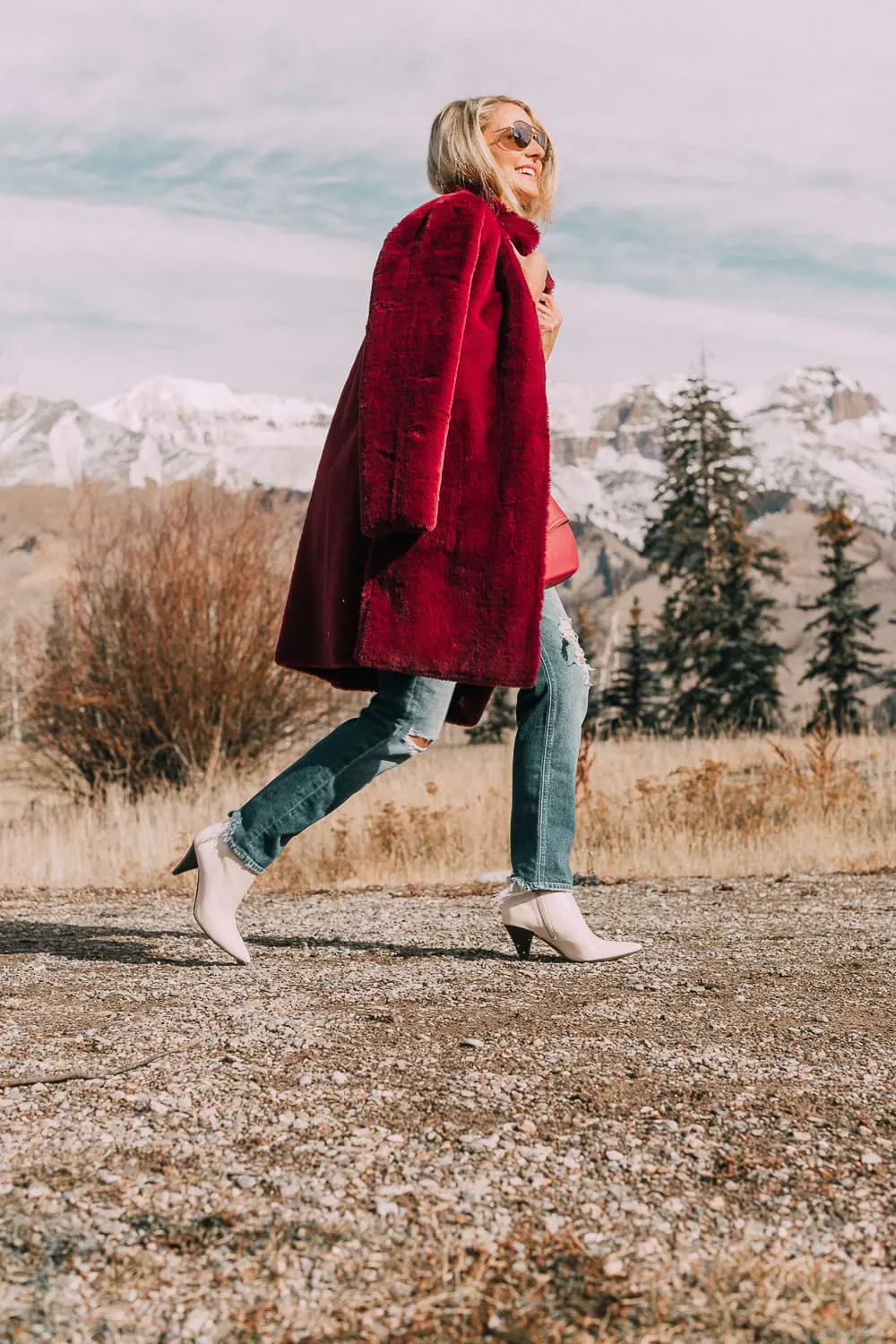 Bootie Trend, how to wear your ankle boots with dresses and jeans featuring white booties with a cone heel by Vince Camuto paired with a reversible faux fur coat, white turtleneck and Mother dazzler jeans