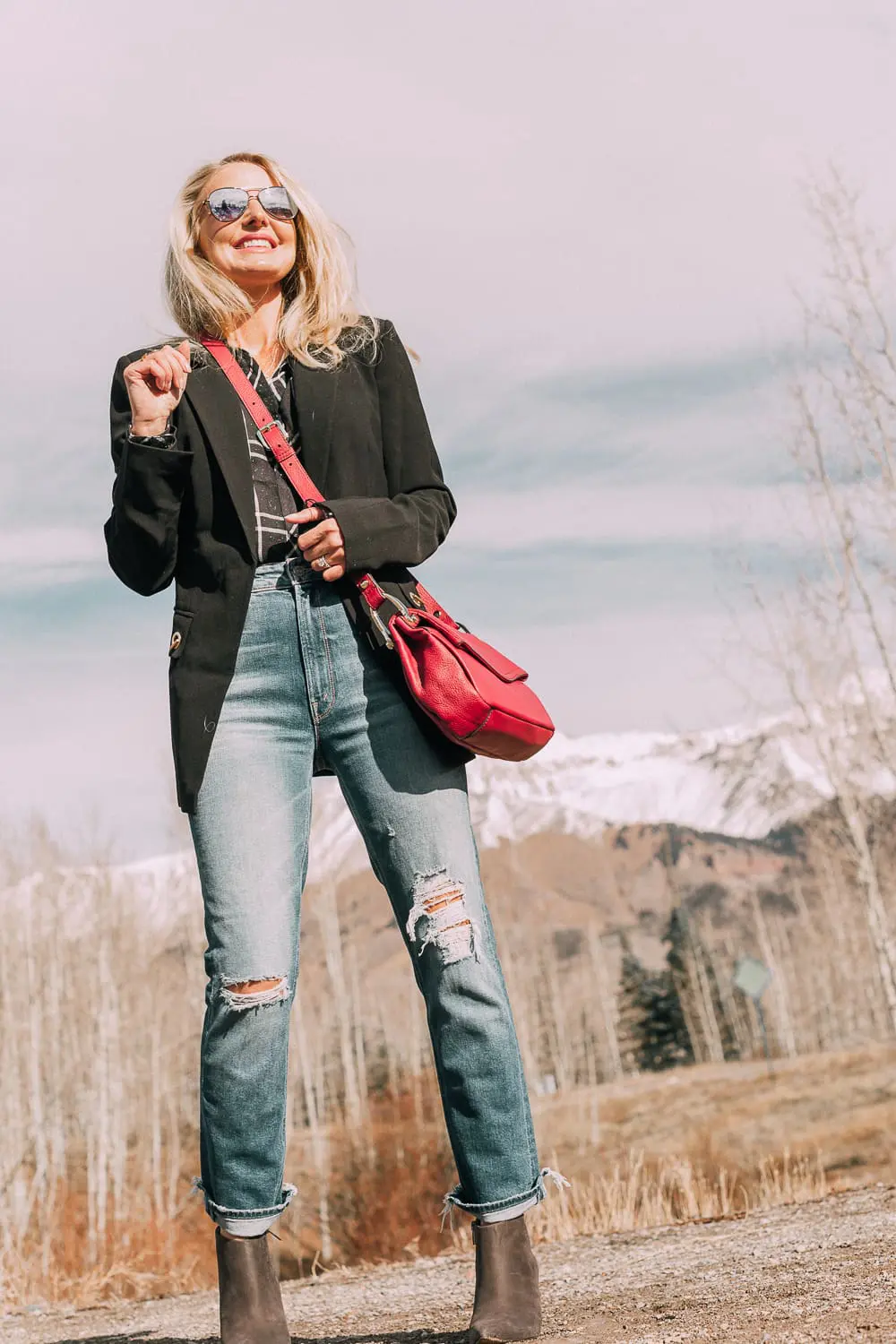 Bootie Trend, styling gray suede short ankle boots by Vince Camuto with Mother cropped jeans, rails black and white plaid shirt, black donna karen blazer and a red crossbody bag on fashion blogger Erin Busbee