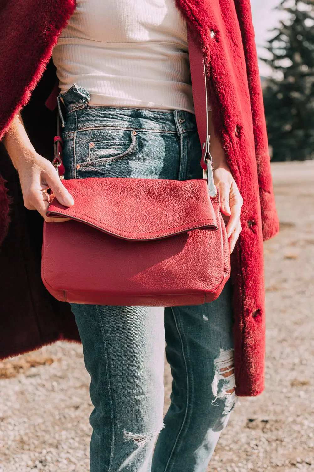 Bootie Trend, how to wear your ankle boots with dresses and jeans featuring white booties with a cone heel by Vince Camuto paired with a reversible faux fur coat, white turtleneck and Mother dazzler jeans
