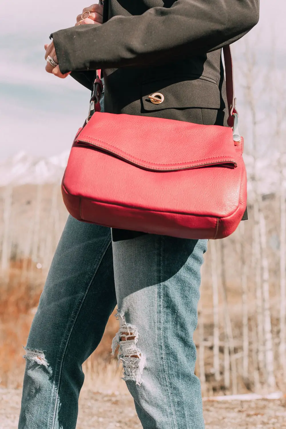 Bootie Trend, styling gray suede short ankle boots by Vince Camuto with Mother cropped jeans, rails black and white plaid shirt, black donna karen blazer and a red crossbody bag on fashion blogger Erin Busbee