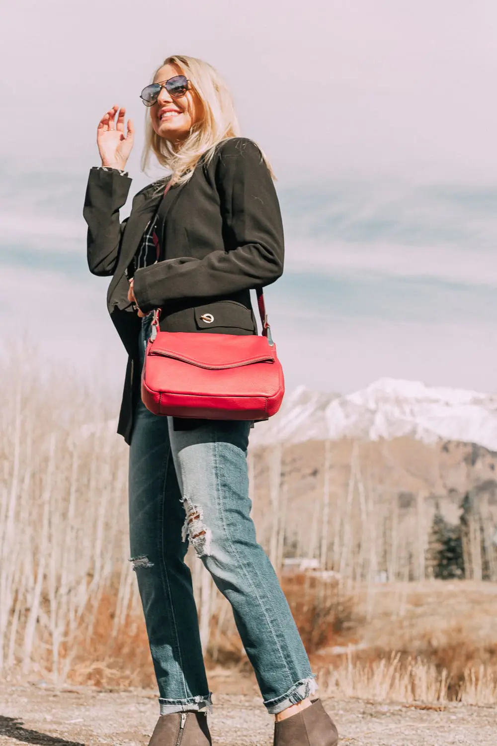 Bootie Trend, styling gray suede short ankle boots by Vince Camuto with Mother cropped jeans, rails black and white plaid shirt, black donna karen blazer and a red crossbody bag on fashion blogger Erin Busbee