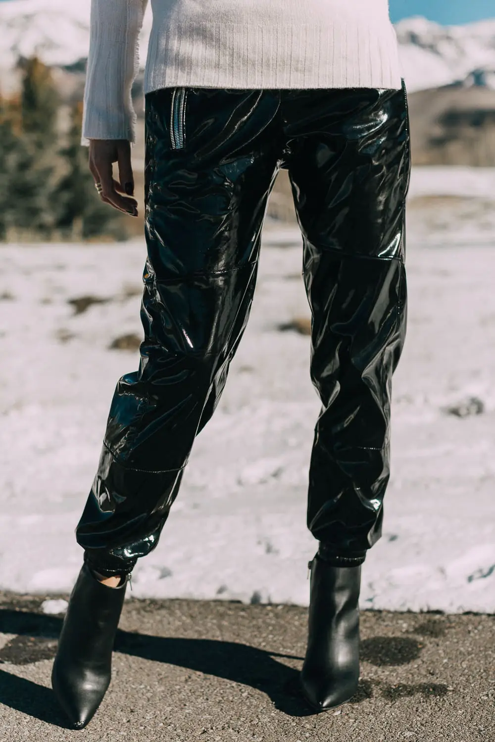 Black vinyl pants by RtA on Fashion blogger over 40 Erin Busbee with black booties by Michael Kors and a white cashmere sweater by Brochu Walker