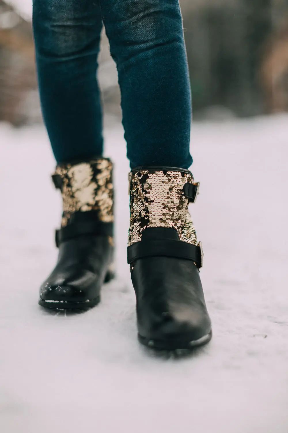 Moto Boots matching mommy and me black and gold moto boots by Vince Camuto on blonde woman and blonde daughter in snow