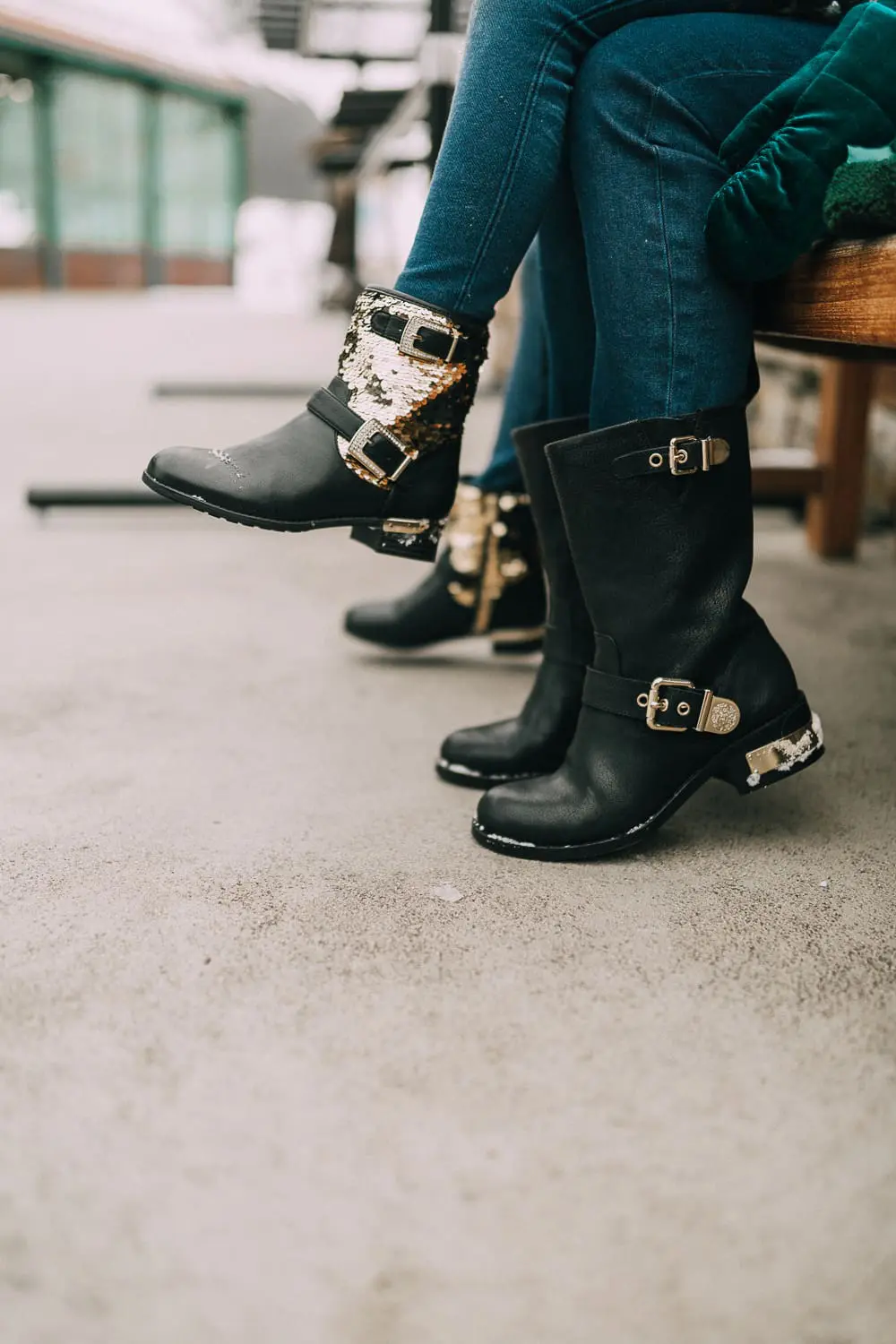 Moto Boots matching mommy and me black and gold moto boots by Vince Camuto on blonde woman and blonde daughter in snow