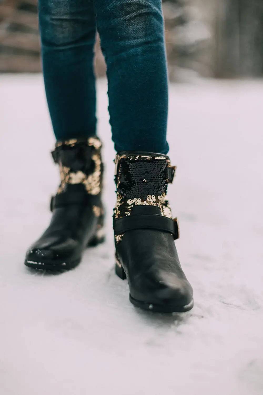 Moto Boots matching mommy and me black and gold moto boots by Vince Camuto on blonde woman and blonde daughter in snow
