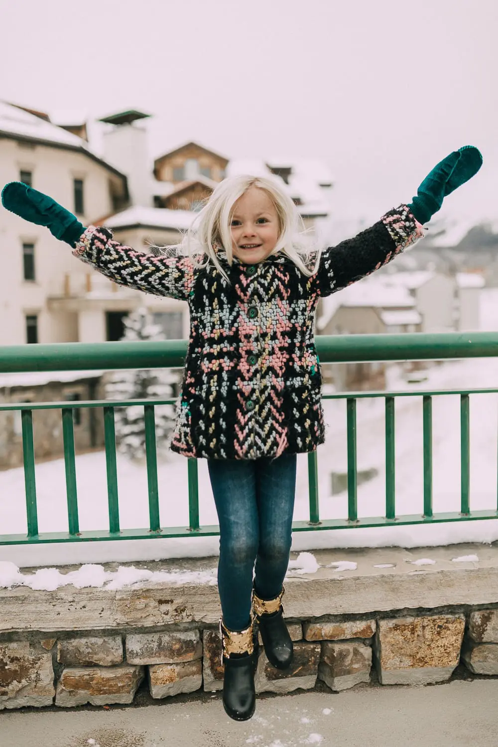 Moto Boots matching mommy and me black and gold moto boots by Vince Camuto on blonde woman and blonde daughter in snow