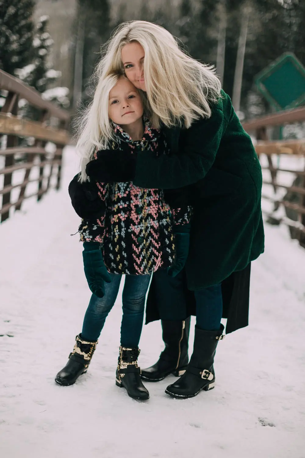 Moto Boots matching mommy and me black and gold moto boots by Vince Camuto on blonde woman and blonde daughter in snow