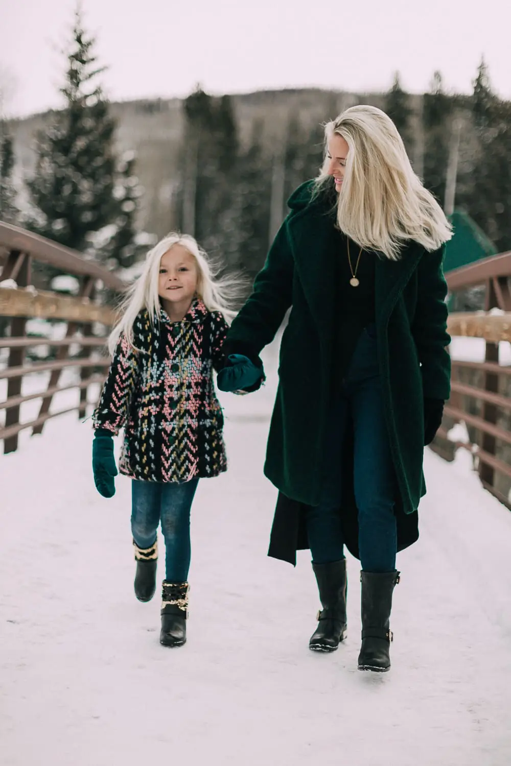 Moto Boots matching mommy and me black and gold moto boots by Vince Camuto on blonde woman and blonde daughter in snow