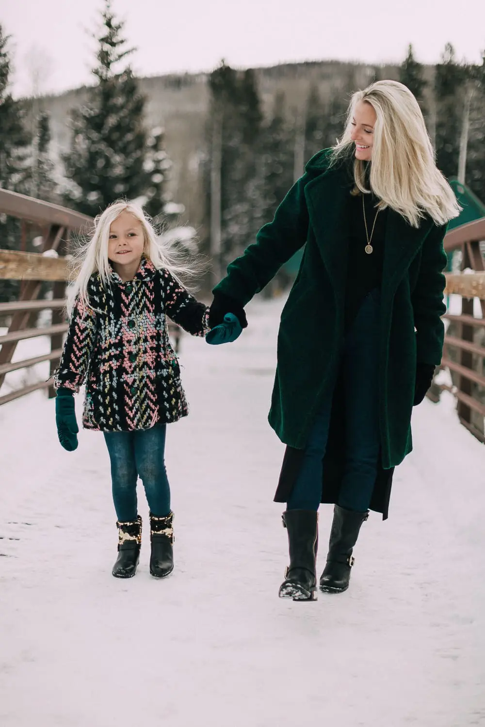 Moto Boots matching mommy and me black and gold moto boots by Vince Camuto on blonde woman and blonde daughter in snow