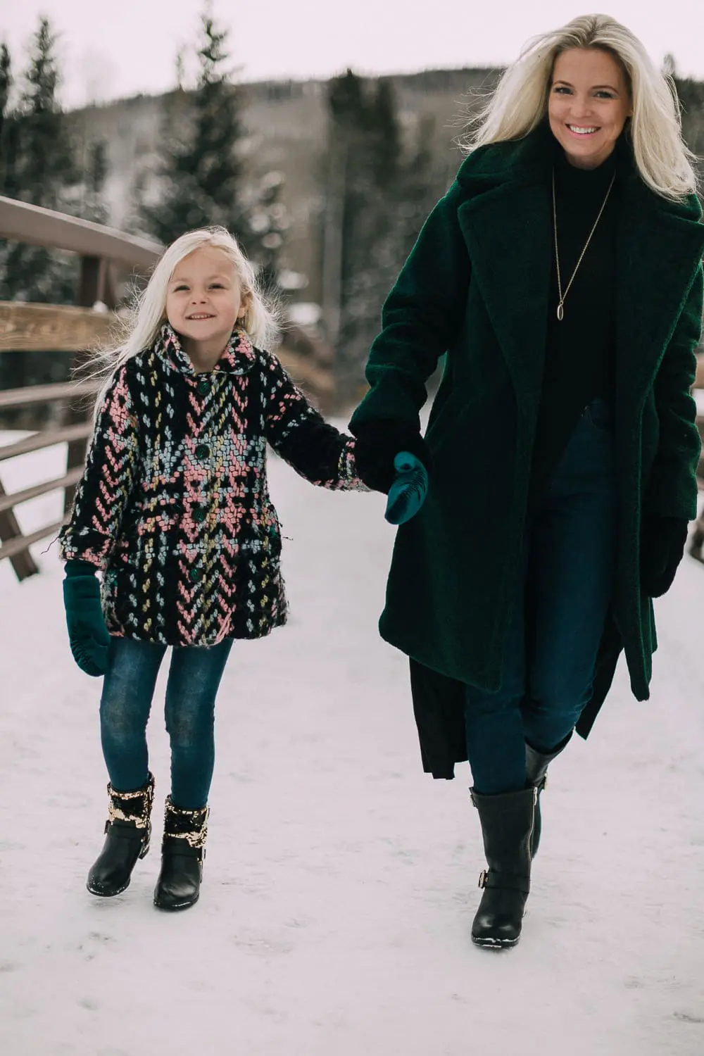 Moto Boots matching mommy and me black and gold moto boots by Vince Camuto on blonde woman and blonde daughter in snow