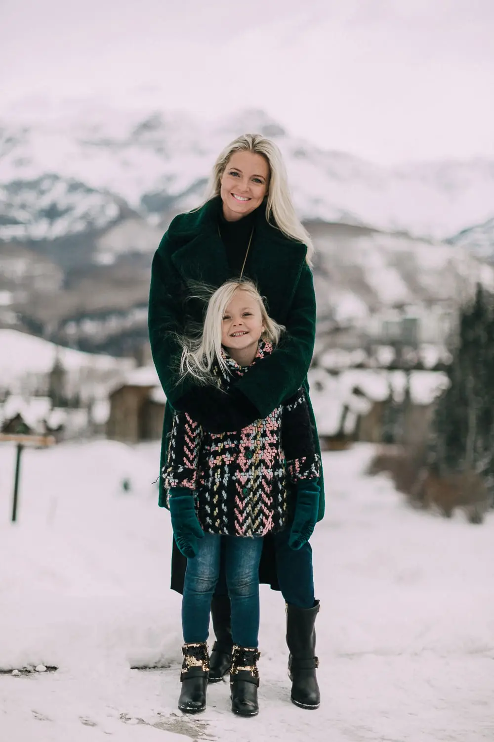 Moto Boots matching mommy and me black and gold moto boots by Vince Camuto on blonde woman and blonde daughter in snow