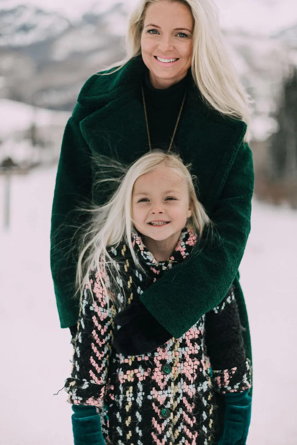 Moto Boots matching mommy and me black and gold moto boots by Vince Camuto on blonde woman and blonde daughter in snow