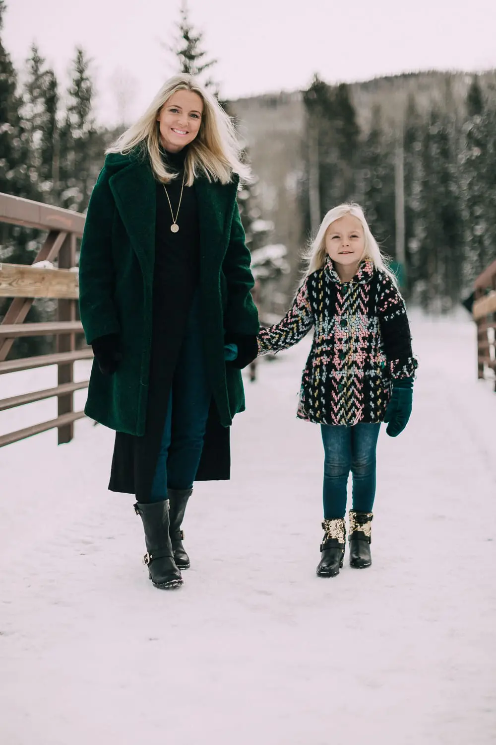 Moto Boots matching mommy and me black and gold moto boots by Vince Camuto on blonde woman and blonde daughter in snow