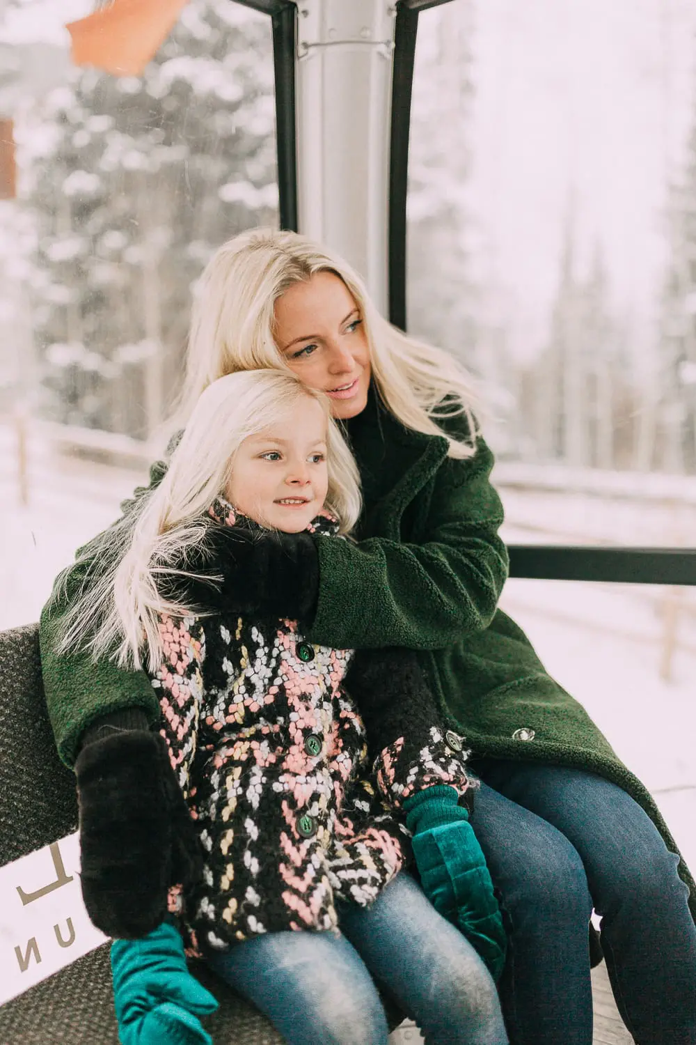 Moto Boots matching mommy and me black and gold moto boots by Vince Camuto on blonde woman and blonde daughter in snow