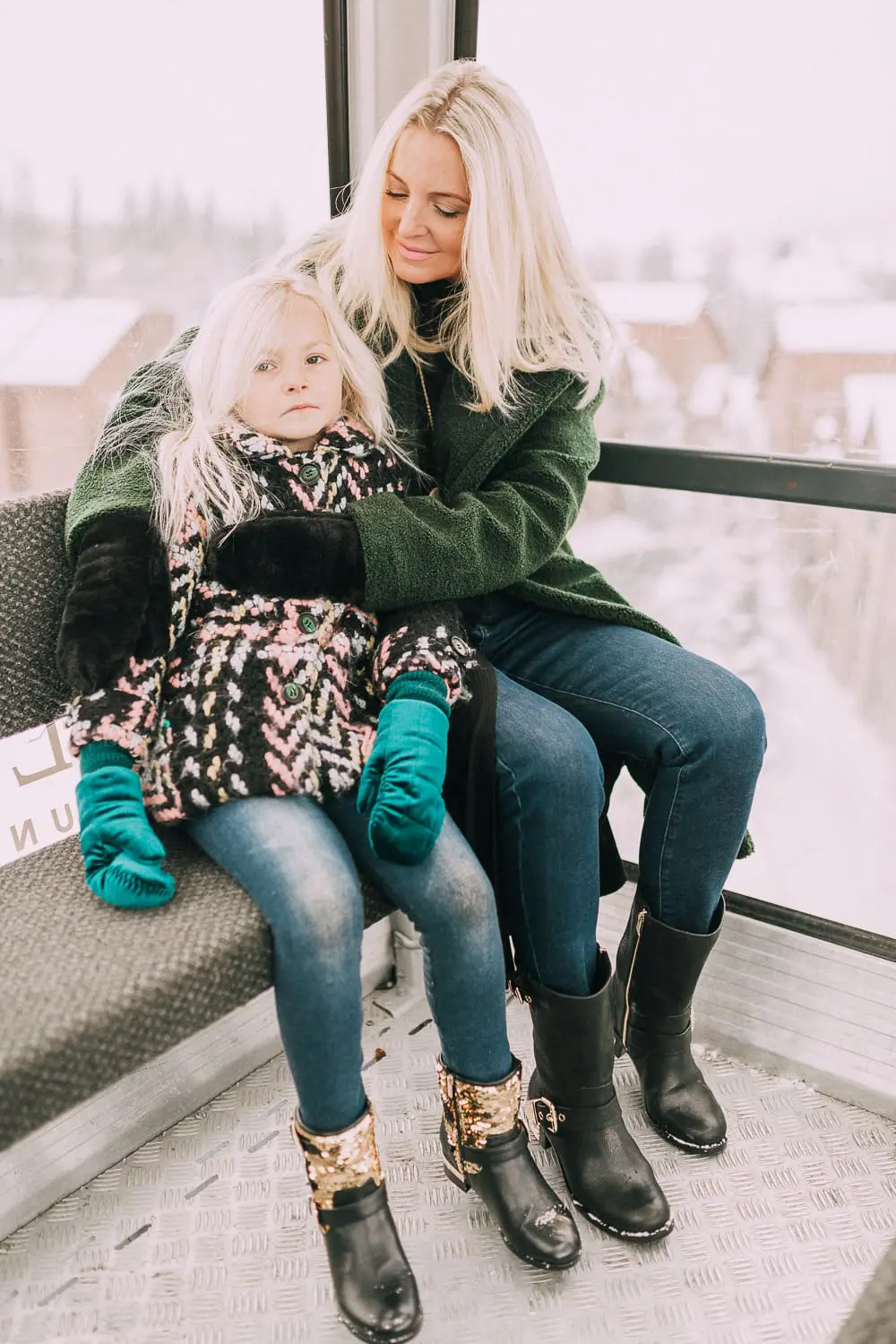 Moto Boots matching mommy and me black and gold moto boots by Vince Camuto on blonde woman and blonde daughter in snow