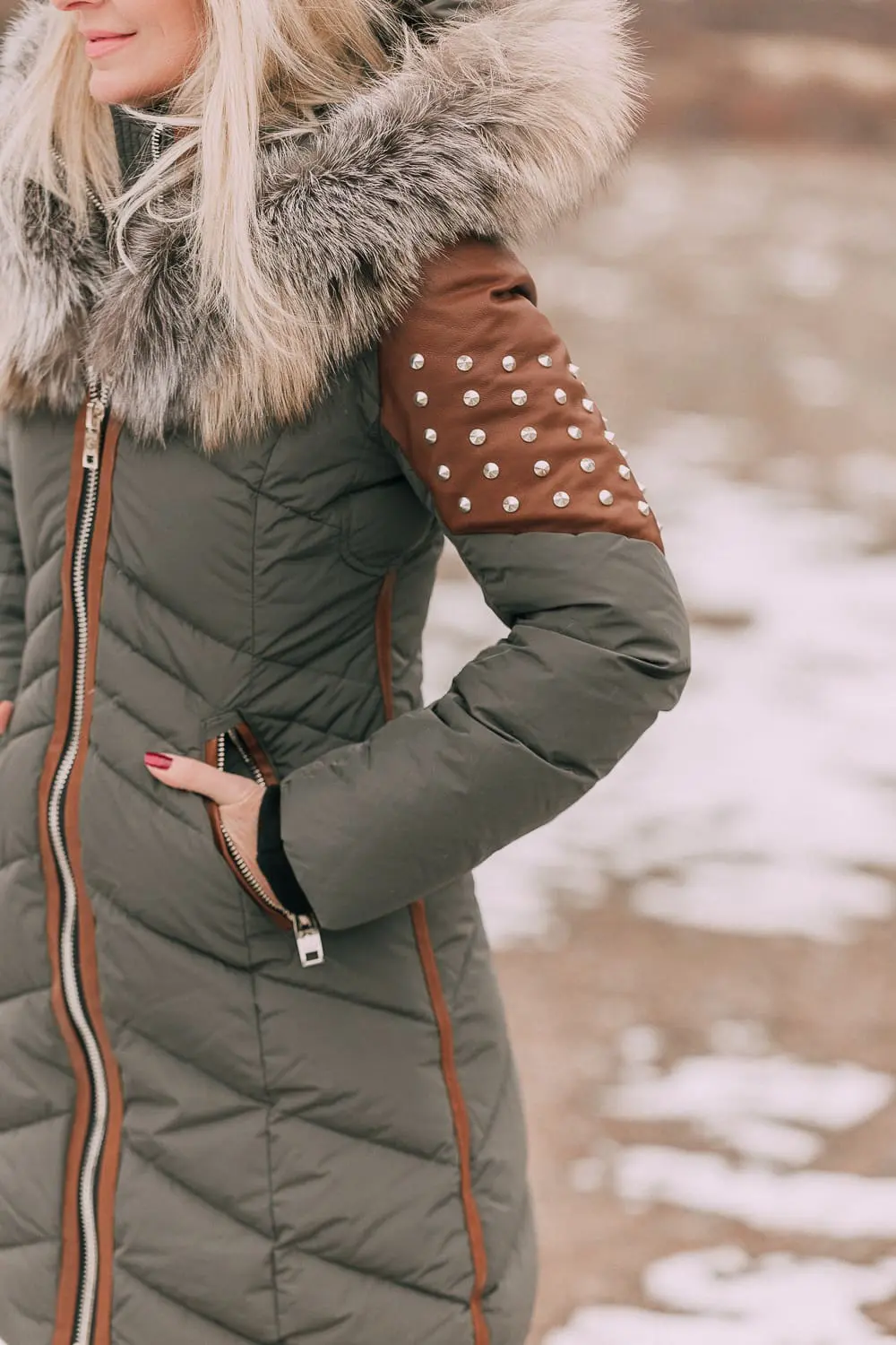 Fashion blogger Erin Busbee of BusbeeStyle.com wearing a Nicole Bensiti Puffer Coat in Green and Brown in Telluride, Colorado