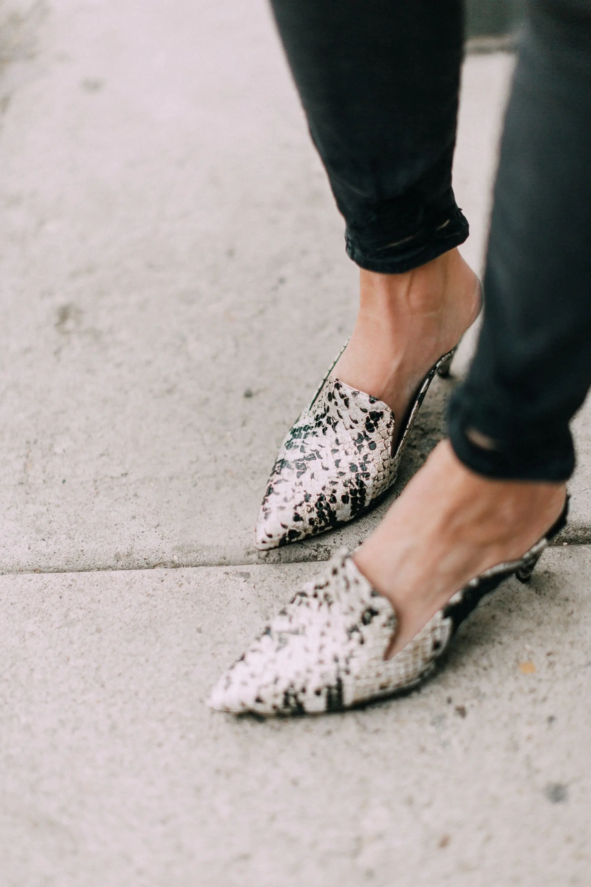 Vince Camuto python Cessilia mules with J Brand black skinny jeans
