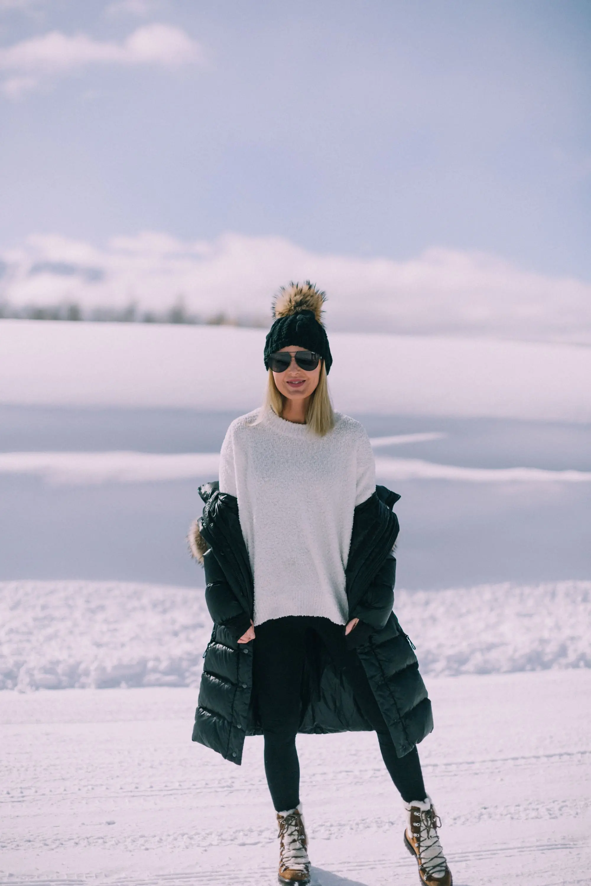 fashion blogger over 40 showing you can wear Spanx seamless leggings as pants with Sanctuary sweater in telluride Colorado