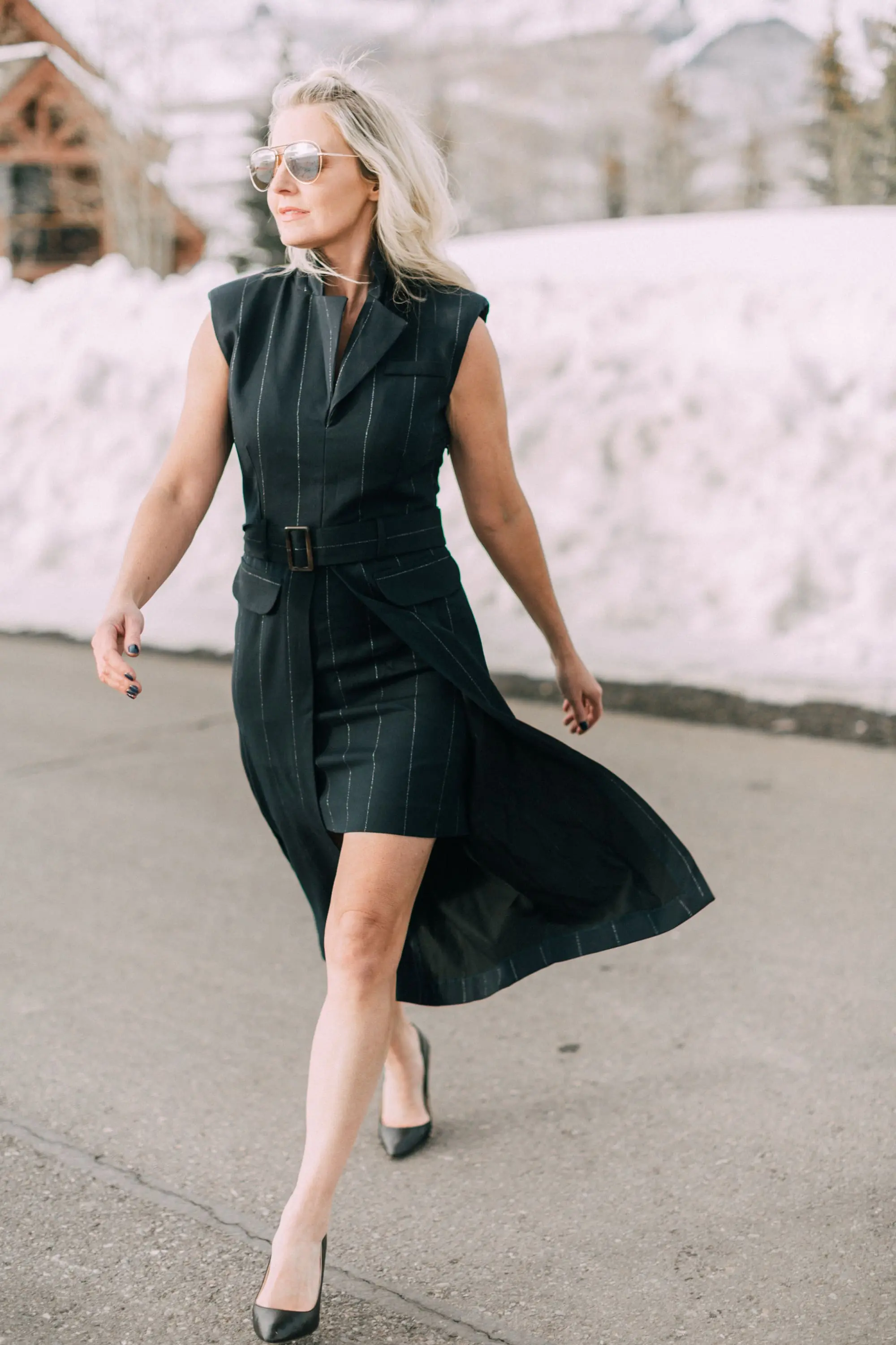 Spring Office Dress, fashion blogger Erin Busbee of BusbeeStyle.com wearing a navy pinstripe dress from Asos with black Jimmy Choo pumps in Telluride, Colorado, talking about dresses for the office