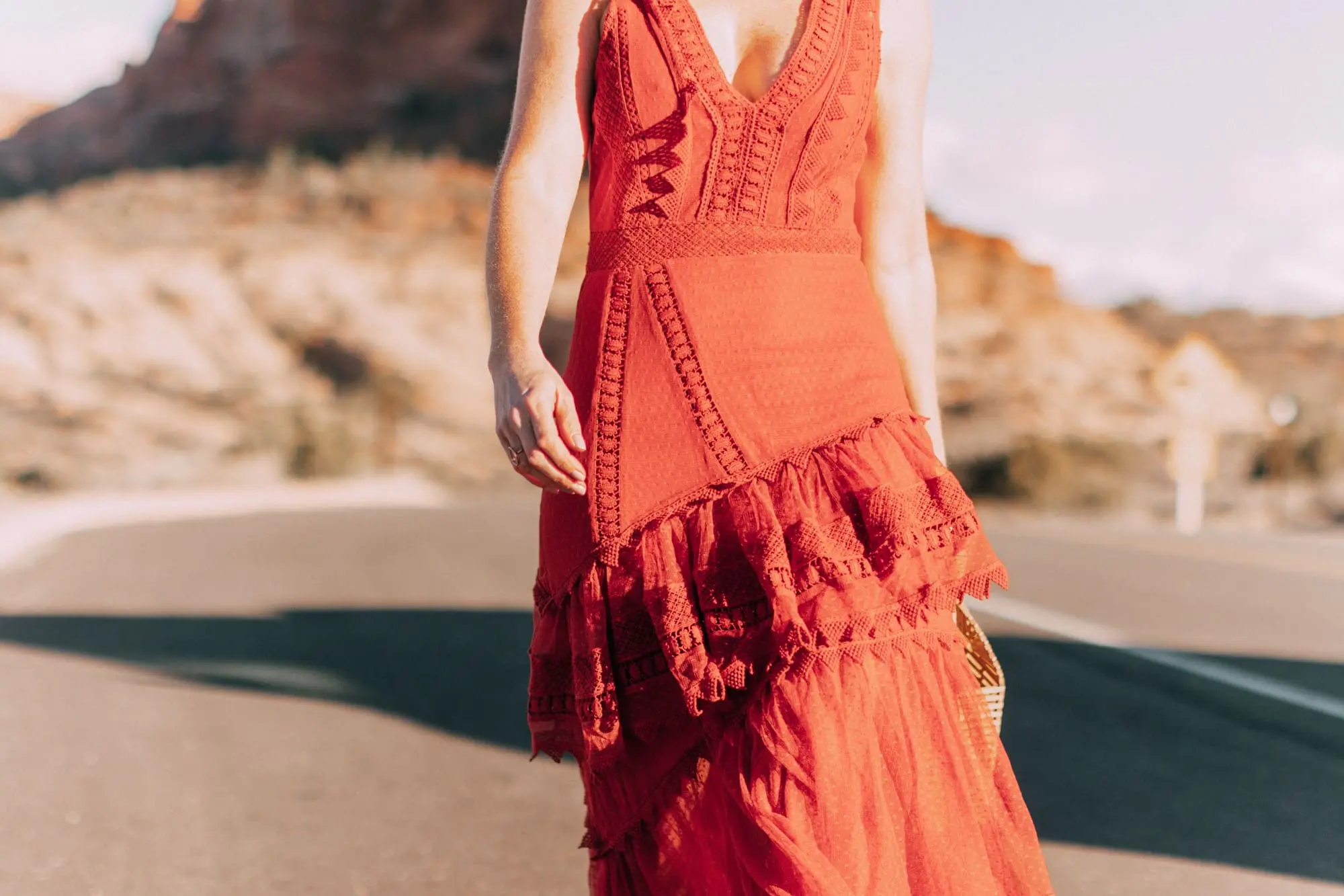 Spring Handbags, Fashion blogger Erin Busbee of BusbeeStyle.com wearing an ornage House of Harlow dress from Revolve with Vince Camuto bamboo basket bag in Moab, Utah