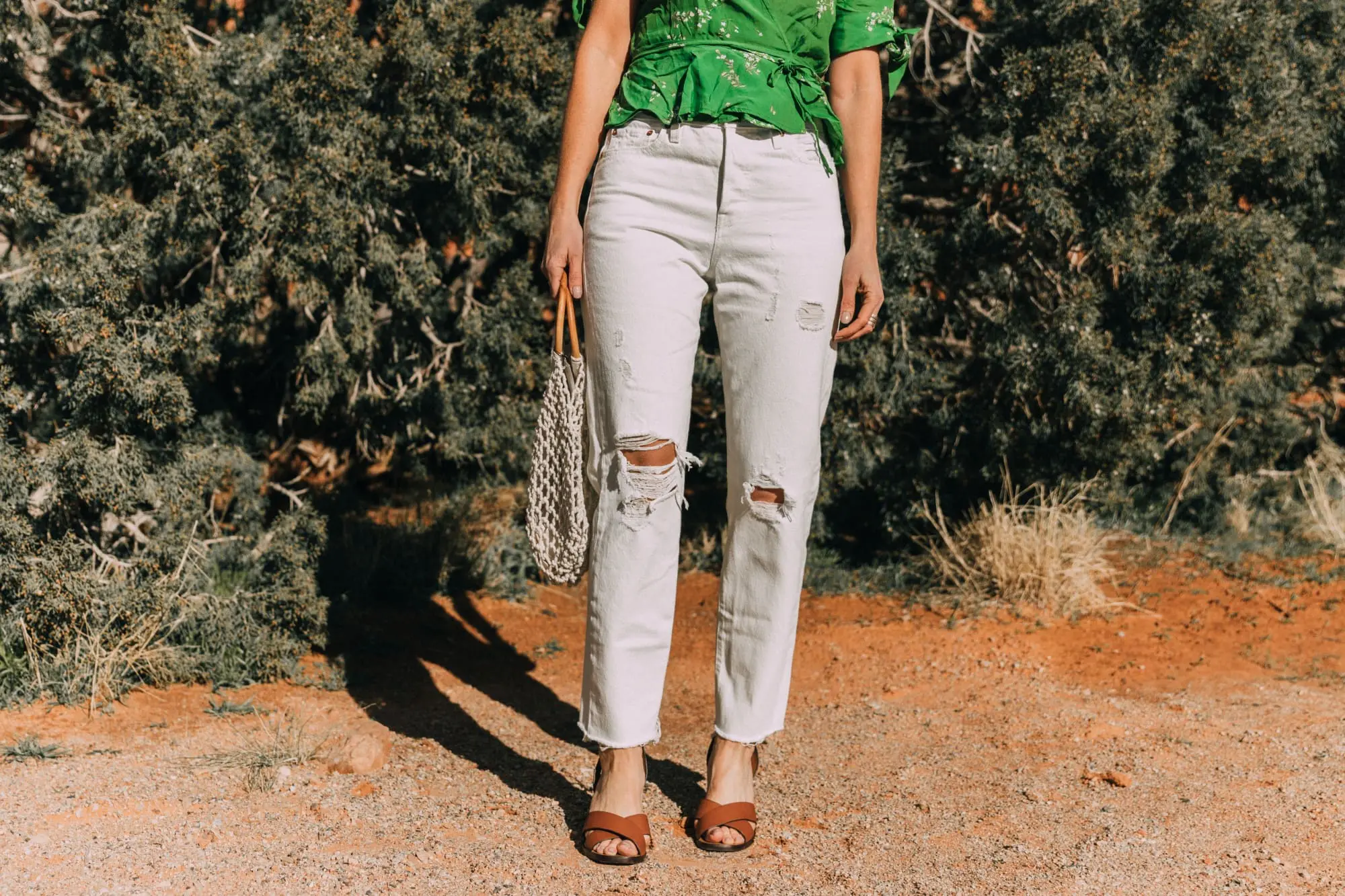 fashion blogger wearing faithfull the brand lucy wrap top white levi's wedgie icon jeans and kayu blake rope satchel