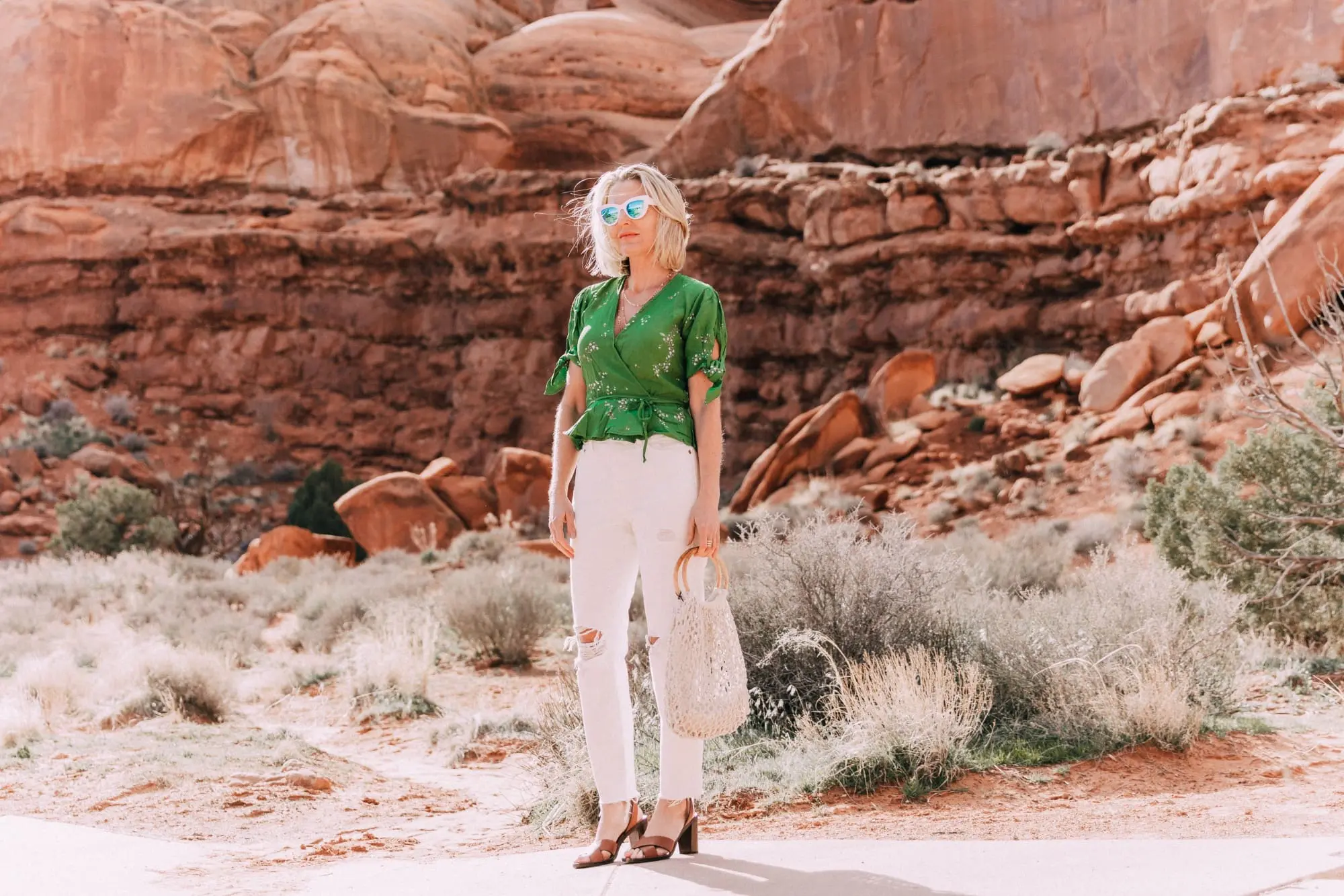 fashion blogger wearing faithfull the brand lucy wrap top white levi's wedgie icon jeans and kayu blake rope satchel