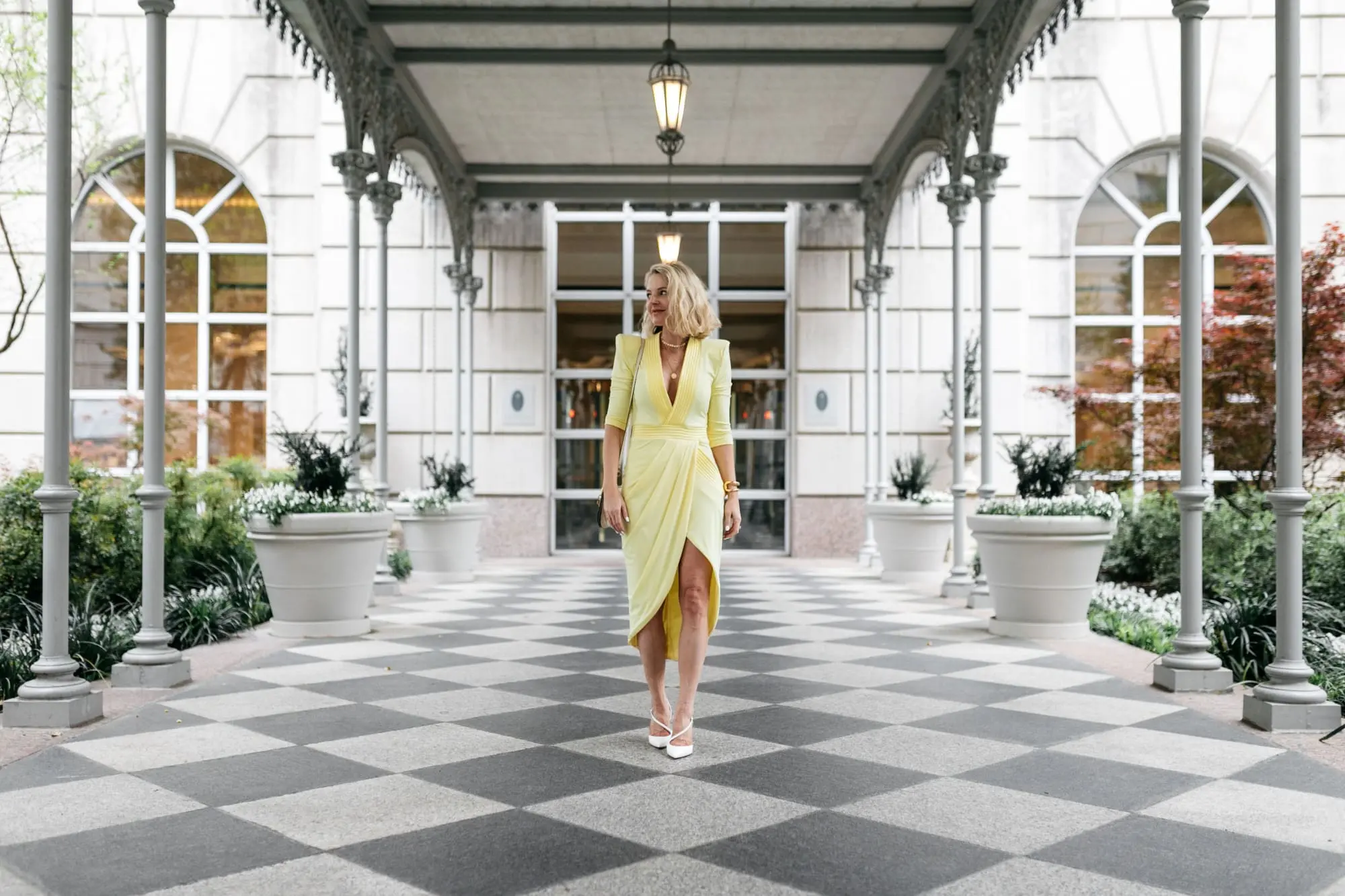 yellow color trend, fashion blogger Erin Busbee at the Reward Style conference in Dallas, Texas wearing a yellow statement dress by Zhivago