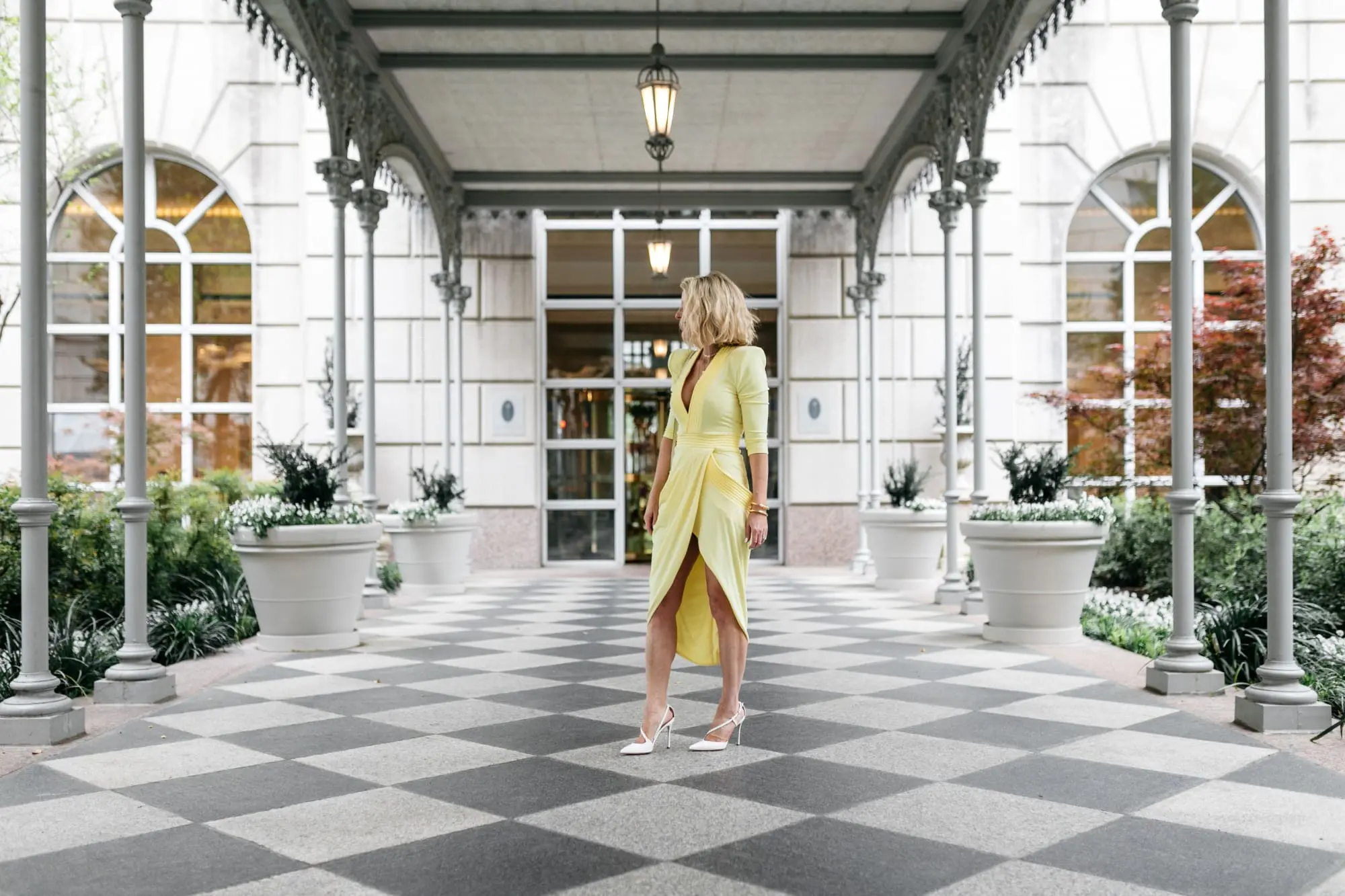yellow color trend, fashion blogger Erin Busbee at the Reward Style conference in Dallas, Texas wearing a yellow statement dress by Zhivago