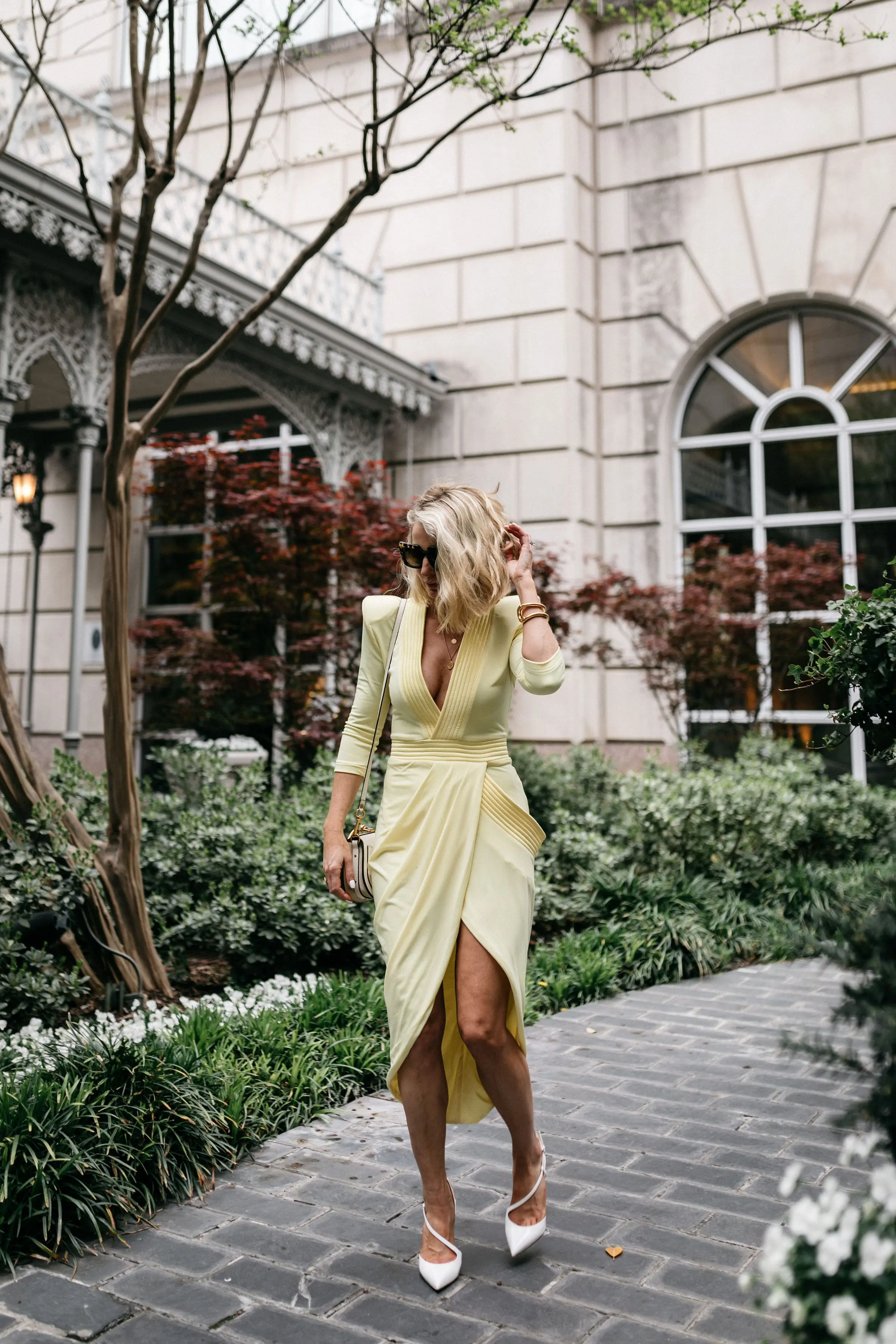 Reward Style Conference 2019, Fashion blogger Erin Busbee of BusbeeStyle.com wearing a yellow Zhivago dress and Sergio Rossi pumps for a cocktail party in Dallas, Texas
