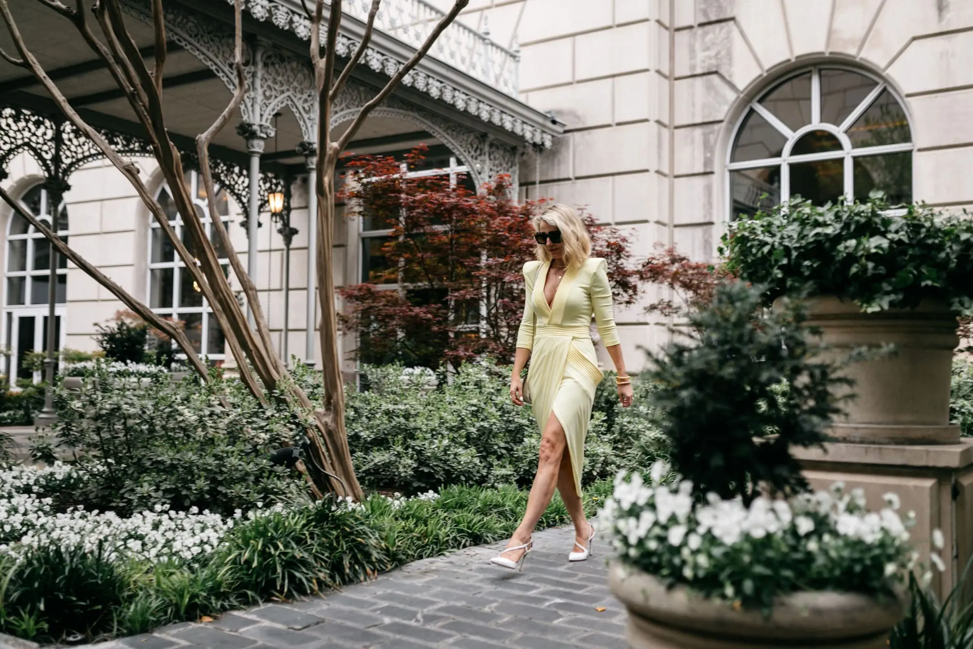 Reward Style Conference 2019, Fashion blogger Erin Busbee of BusbeeStyle.com wearing a yellow Zhivago dress and Sergio Rossi pumps for a cocktail party in Dallas, Texas