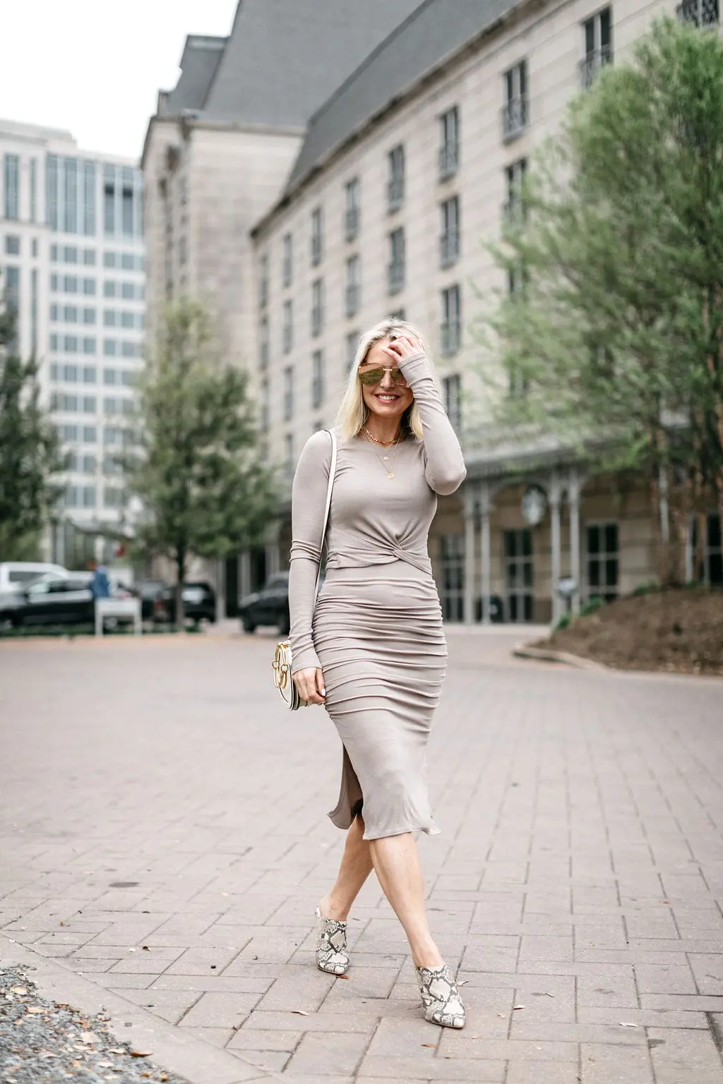 Reward Style Conference 2019, Fashion blogger over 40 Erin Busbee of BusbeeStyle.com wearing a fitted cropped long sleeve top and fitted midi skirt by Made LA from Revolve in Dallas, Texas