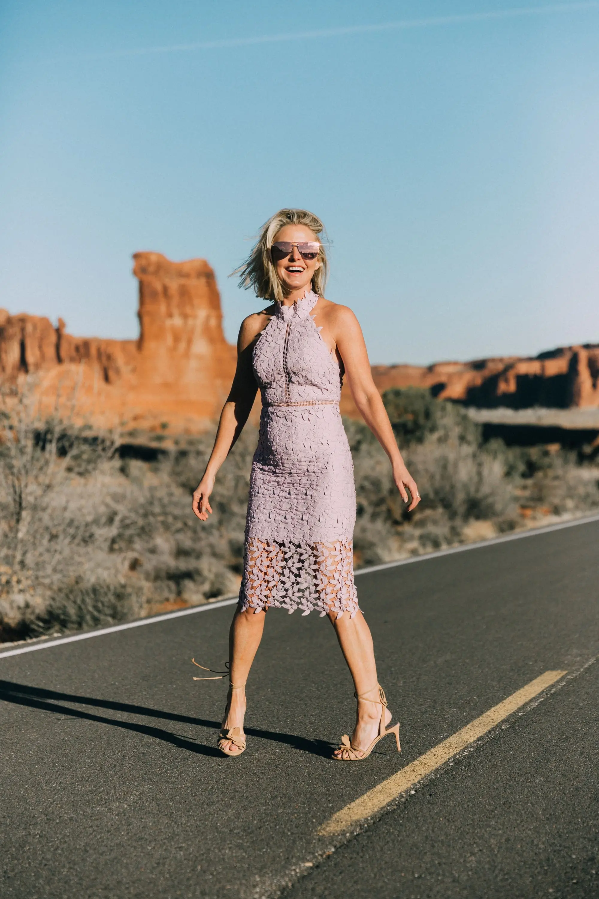 What To Wear To A Spring Wedding, Fashion blogger Erin Busbee of BusbeeStyle.com wearing a lavender lace Bardot dress from Nordstrom with strappy heels from Ann Taylor in Moab, Utah