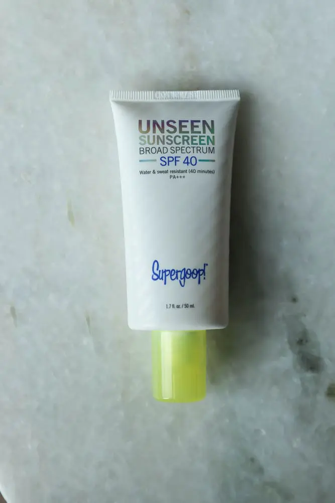 Best Sunscreen, Fashion blogger over 40 Erin Busbee of BusbeeStyle.com featuring the Unseen Screen from Supergoop! in Telluride, CO